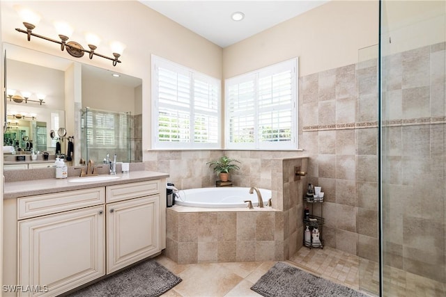 6849 Il Regalo Cir, Naples, FL 34109 - bathroom with vanity, tile patterned floors, a garden tub, and a tile shower