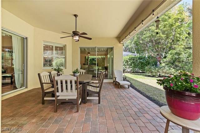 6849 Il Regalo Cir, Naples, FL 34109 - view of patio / terrace with outdoor dining space and a ceiling fan