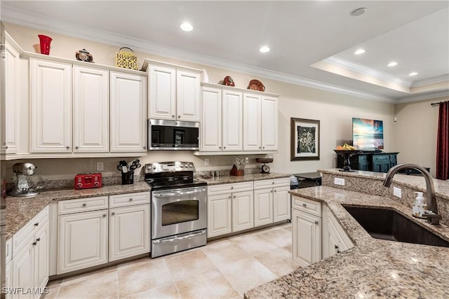 6849 Il Regalo Cir, Naples, FL 34109 - kitchen featuring a sink, stainless steel appliances, ornamental molding, and recessed lighting