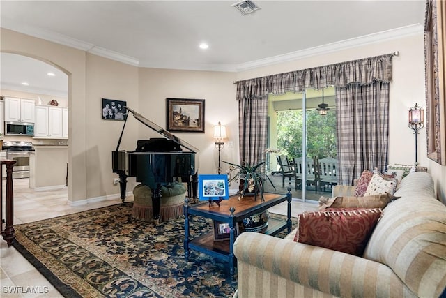 6849 Il Regalo Cir, Naples, FL 34109 - living area with arched walkways, visible vents, crown molding, and baseboards