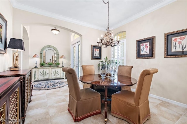 6849 Il Regalo Cir, Naples, FL 34109 - dining area with baseboards, an inviting chandelier, light tile patterned flooring, arched walkways, and ornamental molding