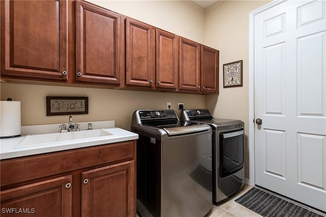 6849 Il Regalo Cir, Naples, FL 34109 - laundry room featuring washing machine and dryer, cabinet space, and a sink