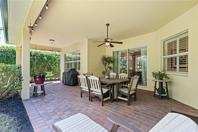 6849 Il Regalo Cir, Naples, FL 34109 - view of patio with outdoor dining space, area for grilling, and a ceiling fan
