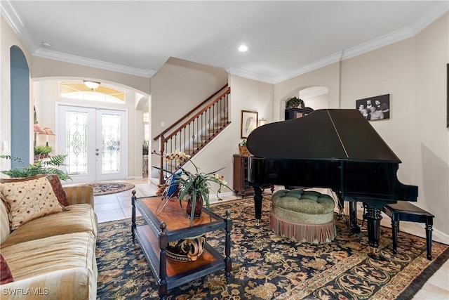 6849 Il Regalo Cir, Naples, FL 34109 - tiled living room featuring arched walkways, french doors, stairs, and crown molding