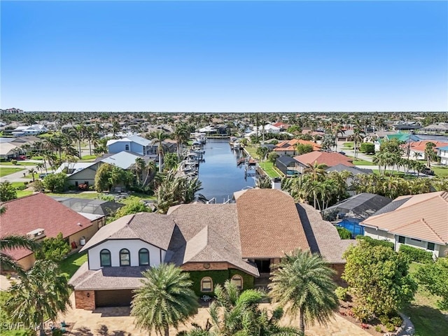 bird's eye view with a residential view and a water view