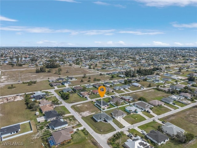 birds eye view of property with a residential view