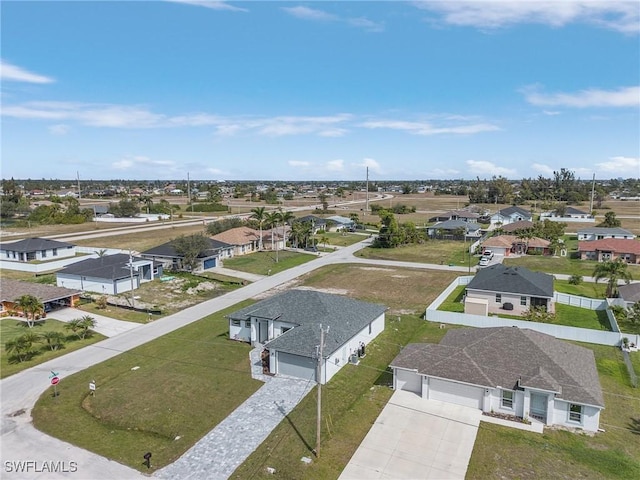 birds eye view of property with a residential view