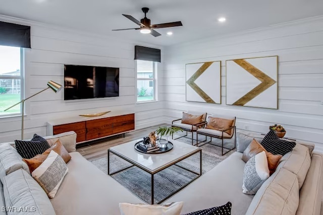 living area with recessed lighting, wood finished floors, and ceiling fan