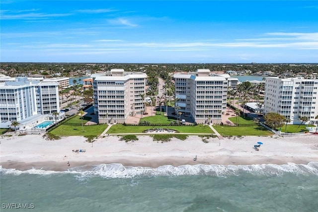 birds eye view of property featuring a city view, a beach view, and a water view