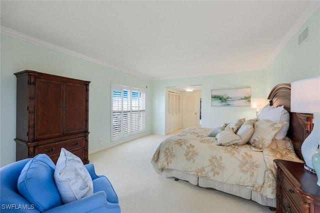 carpeted bedroom with visible vents and ornamental molding