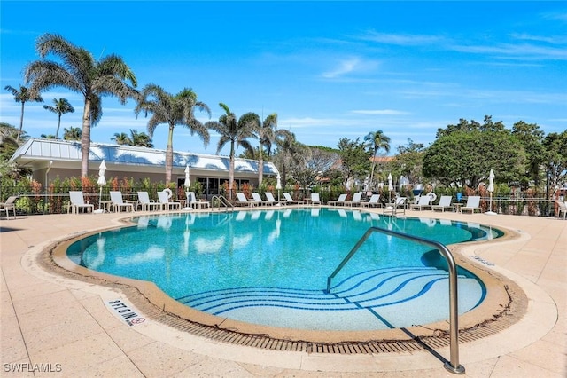 pool featuring a patio and fence