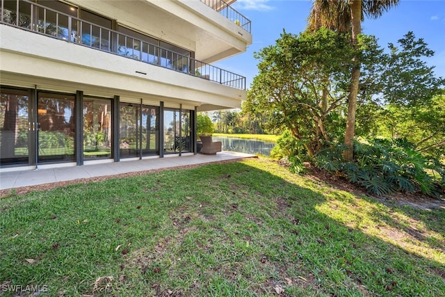 view of yard with a water view