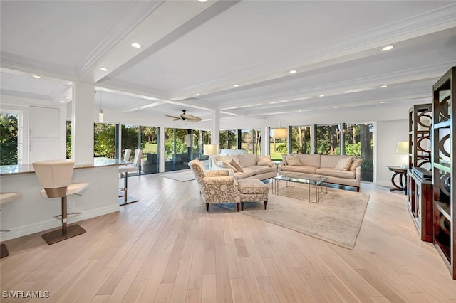 living room featuring light wood-type flooring, beamed ceiling, recessed lighting, and crown molding