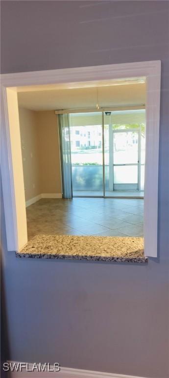 180 Turtle Lake Ct Unit 105, Naples, FL 34105 - spare room featuring baseboards