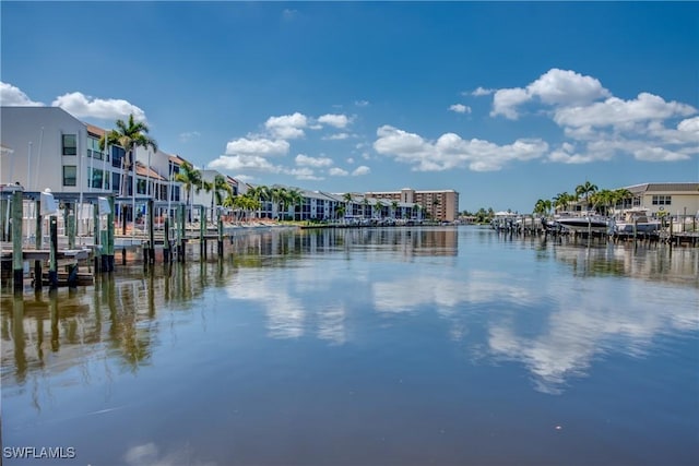 water view with a residential view and a boat dock