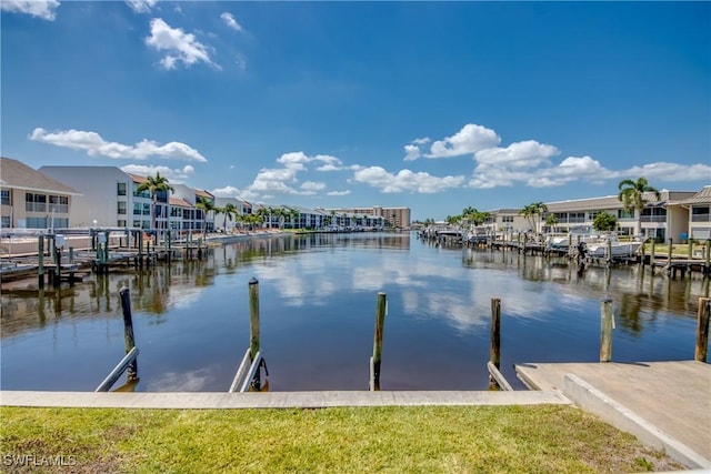 view of dock featuring a residential view and a water view