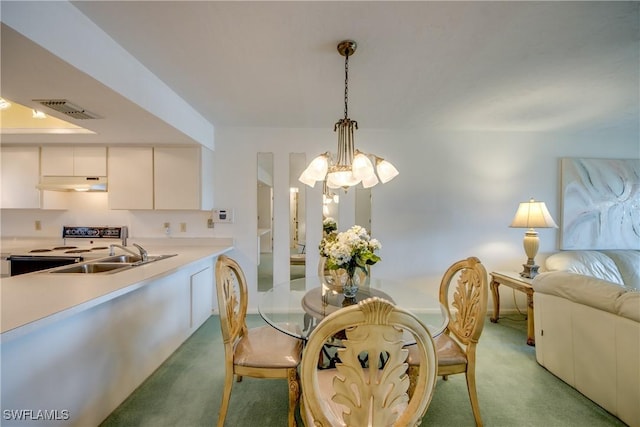 dining space with a chandelier, visible vents, light colored carpet, and baseboards