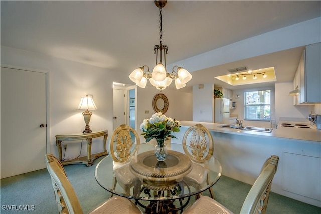 1950 Beach Pkwy Unit 103, Cape Coral, FL 33904 - dining space with a notable chandelier, visible vents, track lighting, and carpet