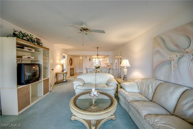 living area with a ceiling fan and carpet floors