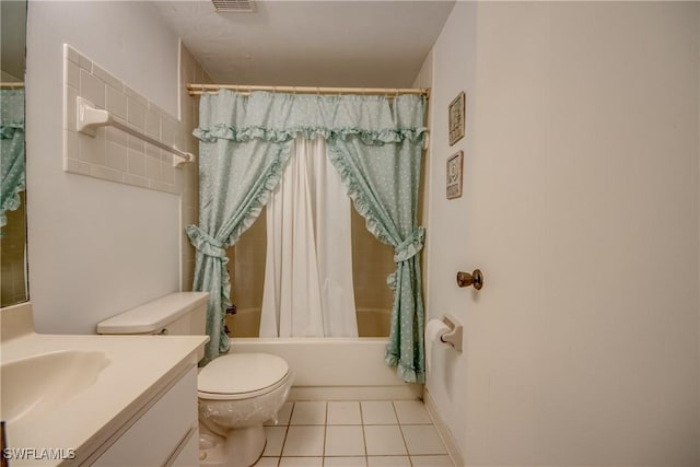 bathroom featuring vanity, tile patterned floors, toilet, and shower / bath combo with shower curtain