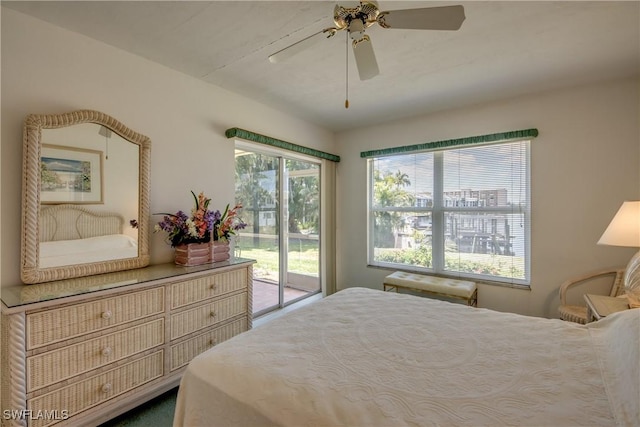 bedroom with ceiling fan and access to outside