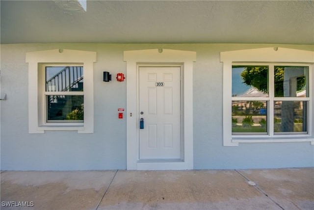1950 Beach Pkwy Unit 103, Cape Coral, FL 33904 - property entrance with stucco siding