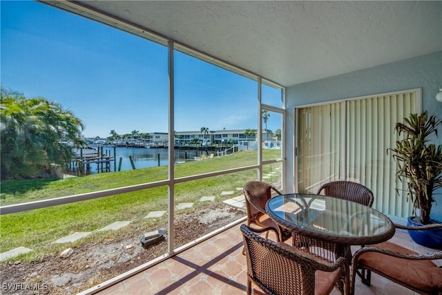 1950 Beach Pkwy Unit 103, Cape Coral, FL 33904 - sunroom / solarium featuring a water view