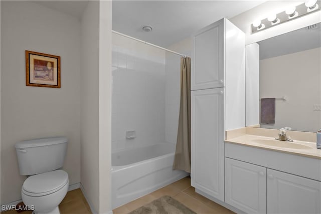 bathroom featuring toilet, shower / bath combo, tile patterned flooring, baseboards, and vanity