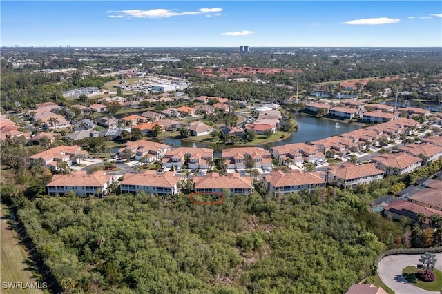 bird's eye view featuring a residential view and a water view