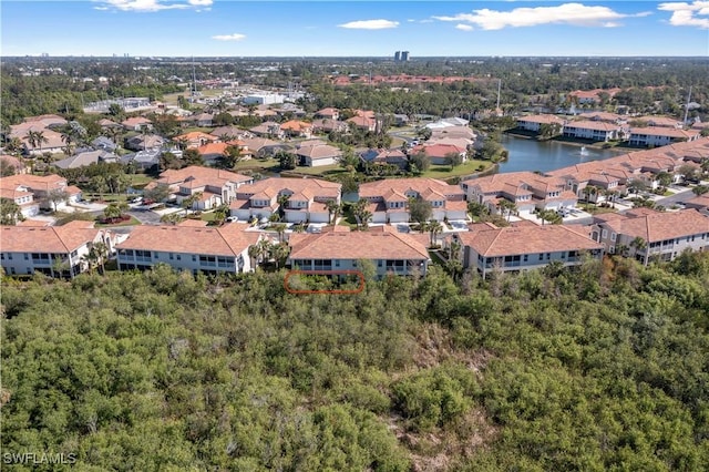 aerial view with a residential view and a water view