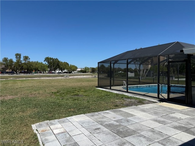 exterior space featuring an outdoor pool and a lanai