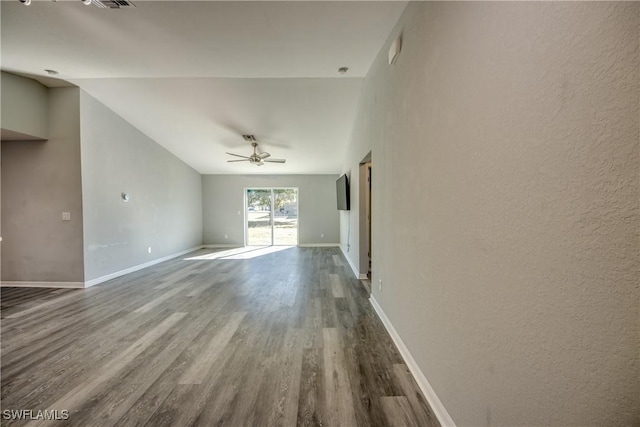 unfurnished living room with ceiling fan, visible vents, baseboards, and wood finished floors