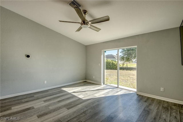 spare room with lofted ceiling, wood finished floors, baseboards, and ceiling fan