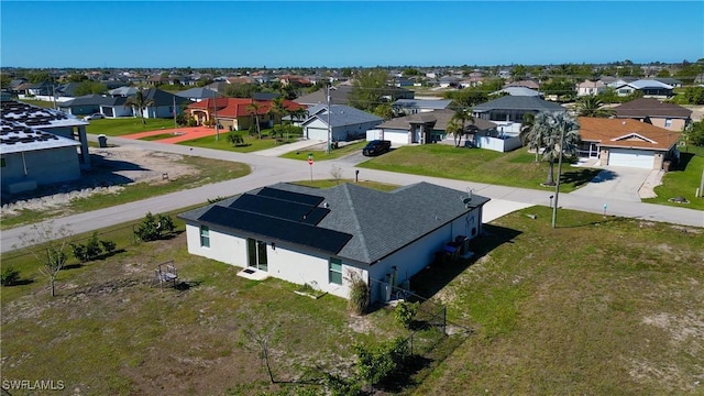 birds eye view of property with a residential view