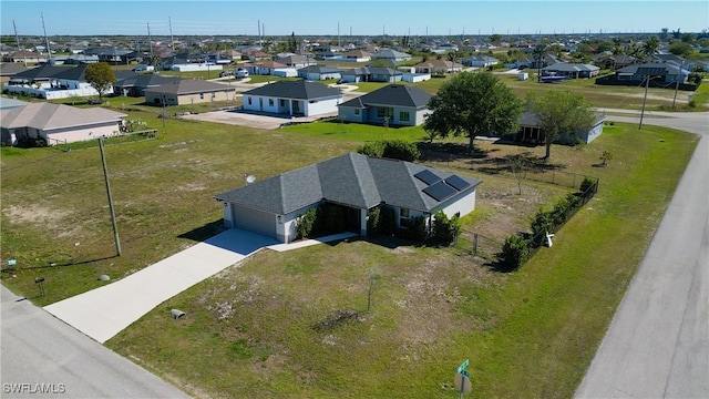 birds eye view of property with a residential view