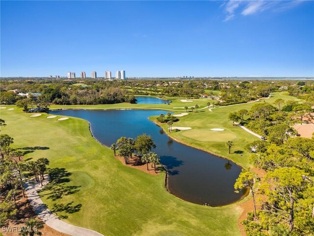 birds eye view of property featuring a water view and golf course view