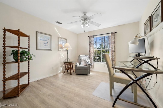 office with visible vents, baseboards, and wood finished floors