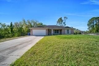 view of front of home featuring concrete driveway, a garage, and a front yard