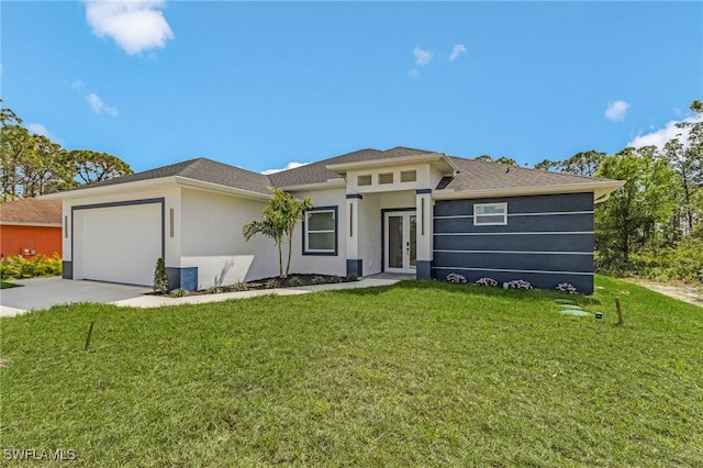 prairie-style house with a front yard, concrete driveway, a garage, and stucco siding