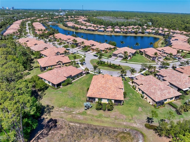 bird's eye view featuring a residential view and a water view