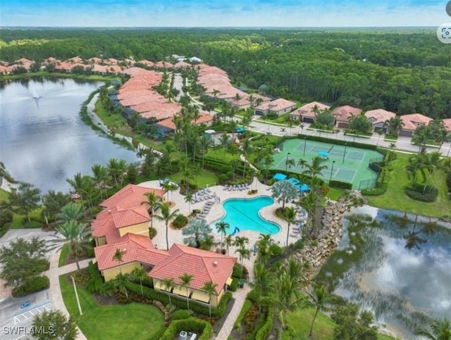 bird's eye view with a water view and a view of trees