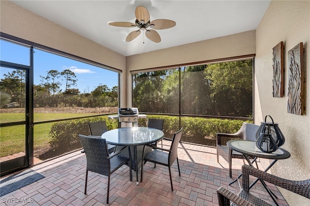 9149 Isla Bella Cir, Bonita Springs, FL 34135 - sunroom / solarium featuring ceiling fan, healthy amount of natural light, and outdoor dining space