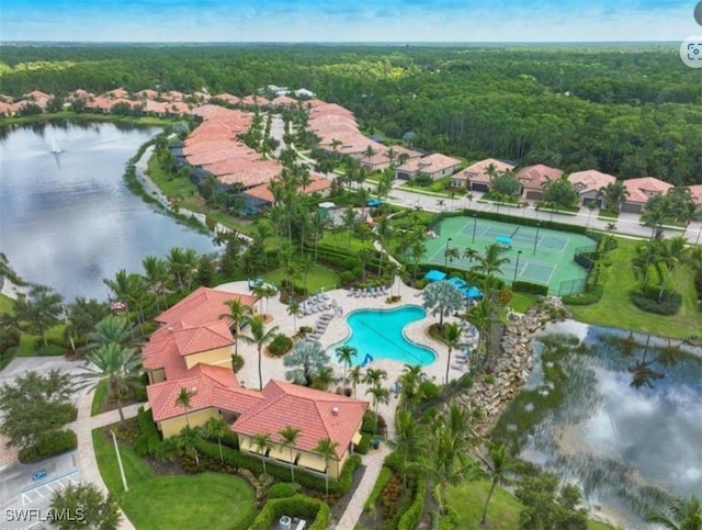 9149 Isla Bella Cir, Bonita Springs, FL 34135 - aerial view of a heavily wooded area, a pool area, and a nearby body of water
