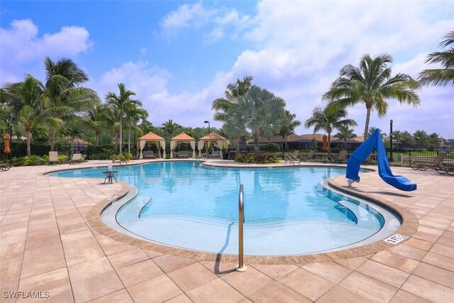 9149 Isla Bella Cir, Bonita Springs, FL 34135 - community pool with a gazebo and a patio
