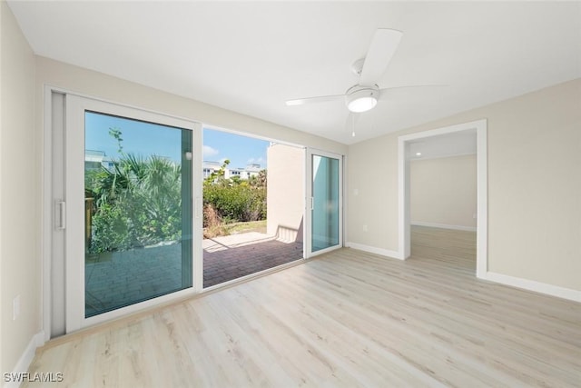 200 Periwinkle Way Unit 132, Sanibel, FL 33957 - unfurnished room with baseboards, wood finished floors, and a ceiling fan