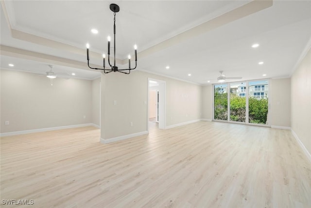 200 Periwinkle Way Unit 132, Sanibel, FL 33957 - interior space with ceiling fan with notable chandelier, crown molding, and light wood-style floors