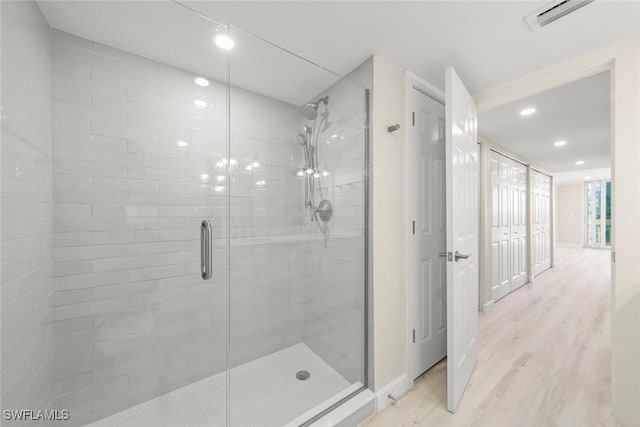 200 Periwinkle Way Unit 132, Sanibel, FL 33957 - full bathroom with visible vents, wood finished floors, a stall shower, and recessed lighting