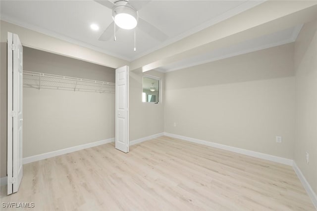 200 Periwinkle Way Unit 132, Sanibel, FL 33957 - unfurnished bedroom featuring baseboards, crown molding, a closet, and light wood-type flooring