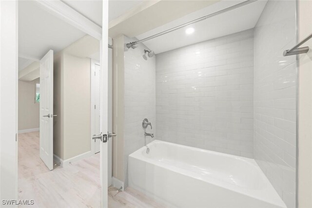 200 Periwinkle Way Unit 132, Sanibel, FL 33957 - full bathroom with shower / bathtub combination, baseboards, and wood finished floors