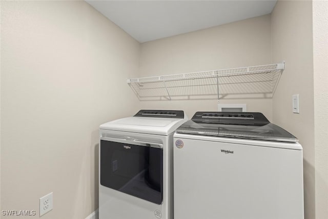 200 Periwinkle Way Unit 132, Sanibel, FL 33957 - laundry area with washer and dryer and laundry area